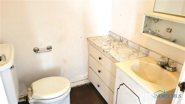 bathroom with vanity and toilet