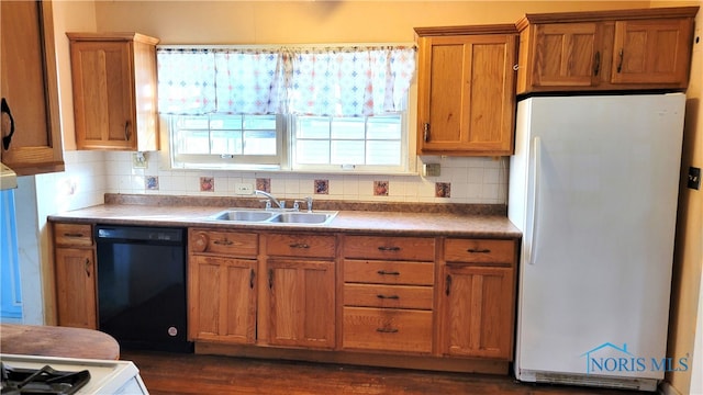 kitchen featuring decorative backsplash, dark hardwood / wood-style floors, sink, white refrigerator, and black dishwasher