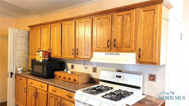 kitchen featuring white range with gas stovetop, backsplash, and crown molding