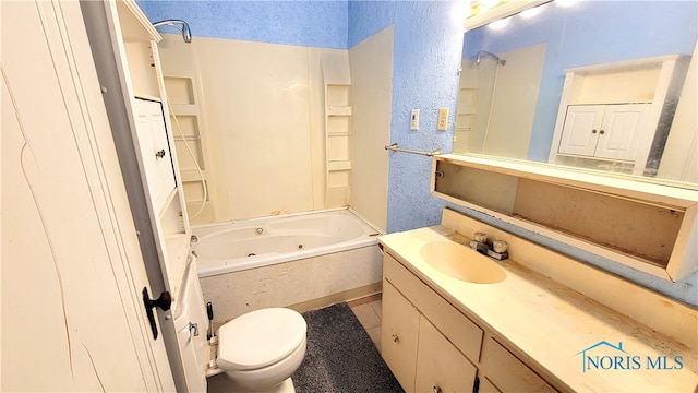 bathroom with vanity, tile patterned flooring, and toilet