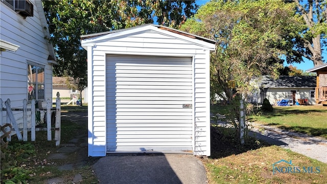 garage featuring wooden walls