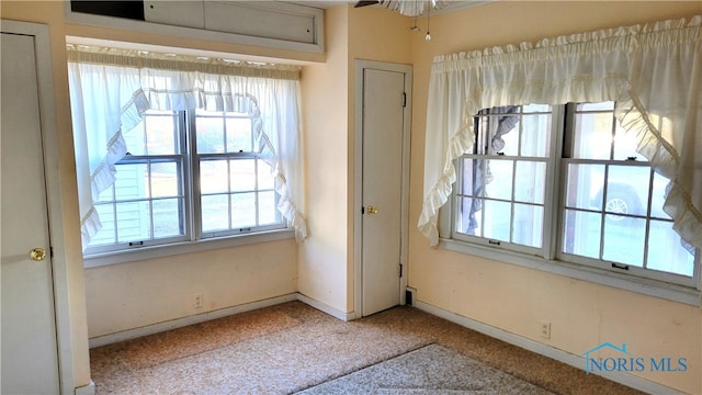 interior space featuring ceiling fan