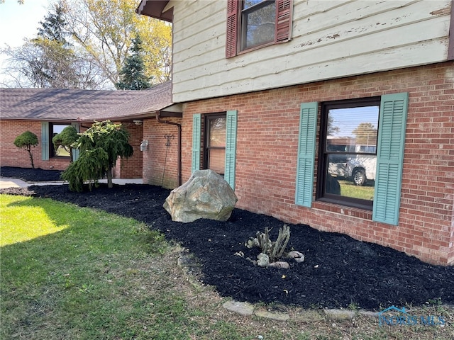 view of home's exterior featuring a yard