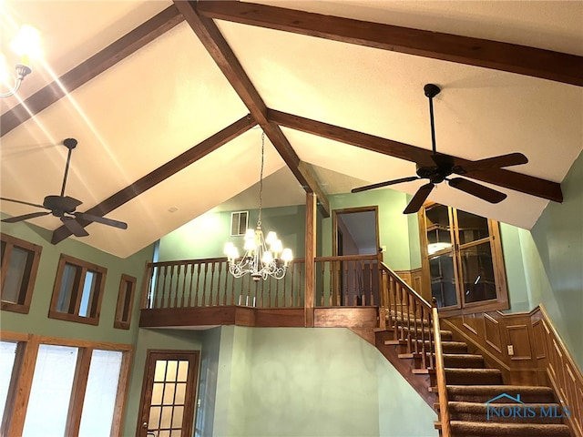 room details featuring beamed ceiling and a notable chandelier