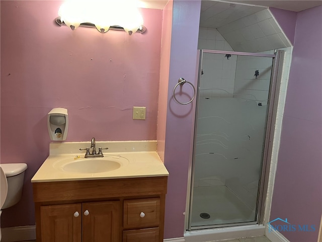 bathroom featuring walk in shower, vanity, and toilet