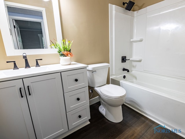 full bathroom featuring shower / bath combination, toilet, hardwood / wood-style floors, and vanity