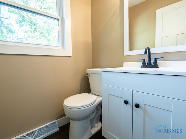 bathroom with vanity and toilet