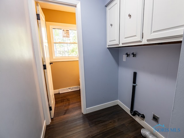 washroom featuring cabinets, dark wood-type flooring, and electric dryer hookup