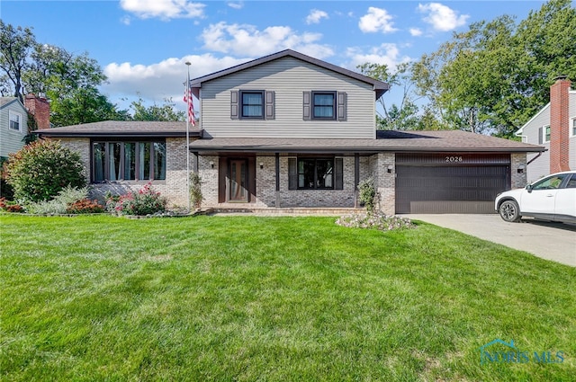 view of front facade featuring a garage and a front yard