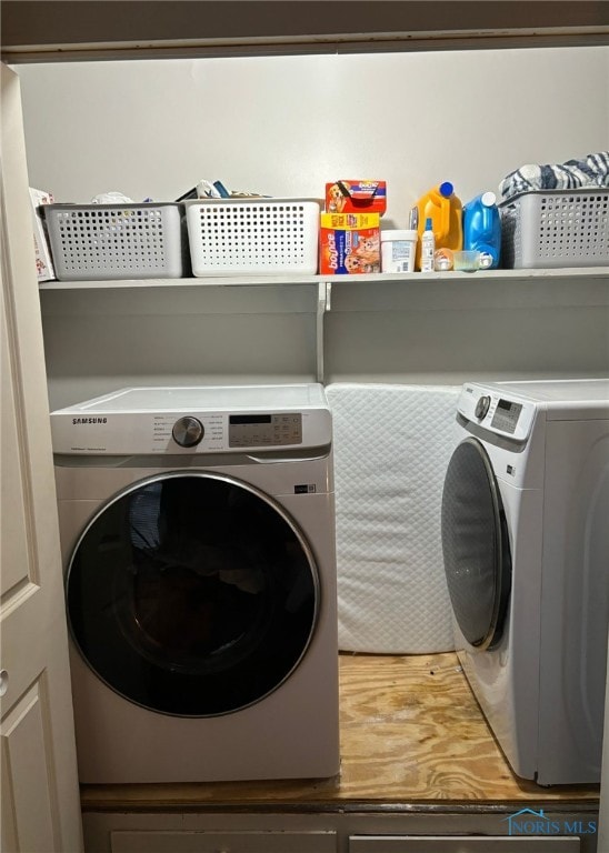 clothes washing area featuring washing machine and clothes dryer