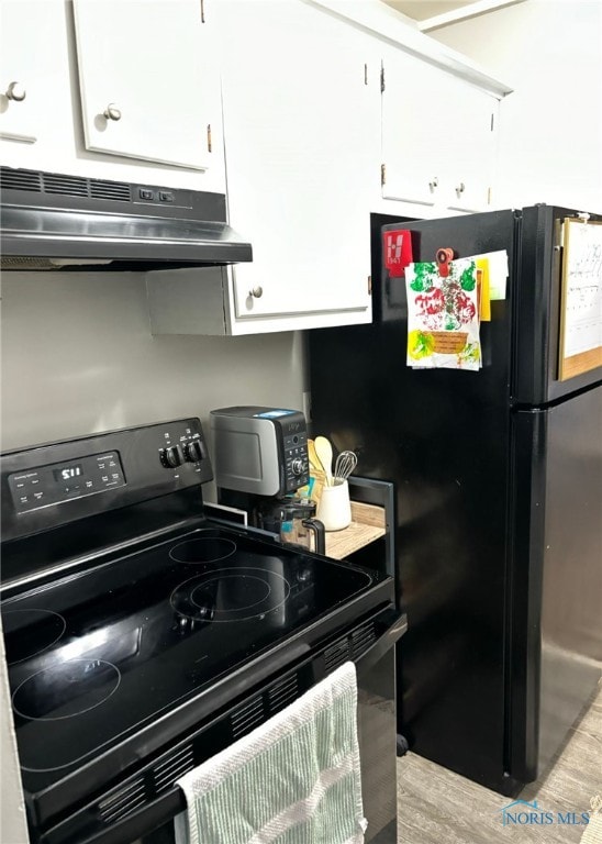 kitchen with black appliances, light wood-type flooring, white cabinetry, and range hood