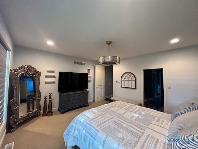 bedroom featuring light carpet