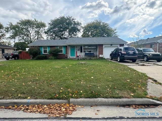 view of front facade with a front yard and a garage