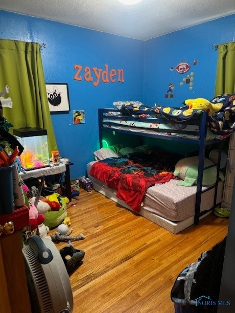 bedroom featuring wood-type flooring