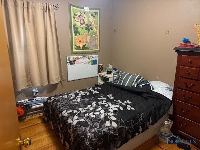 bedroom with light hardwood / wood-style floors