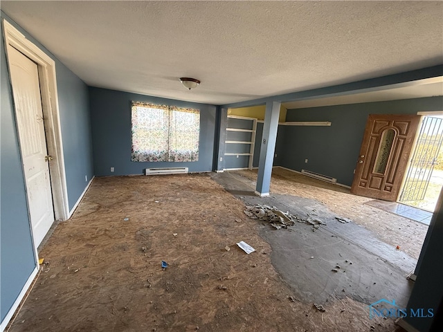 unfurnished living room with a textured ceiling and a baseboard heating unit