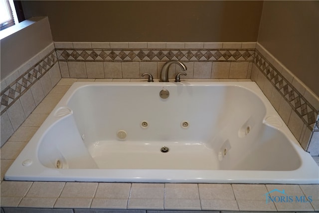 bathroom featuring tiled bath