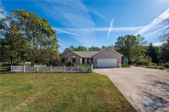 ranch-style house featuring a front lawn and a garage