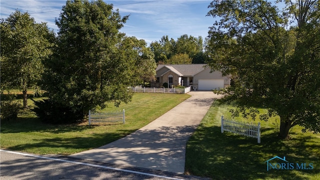 view of front of house with a front lawn and a garage