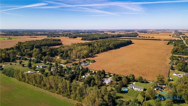 birds eye view of property with a rural view