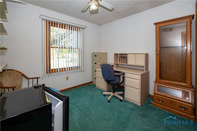 home office with ceiling fan and dark carpet