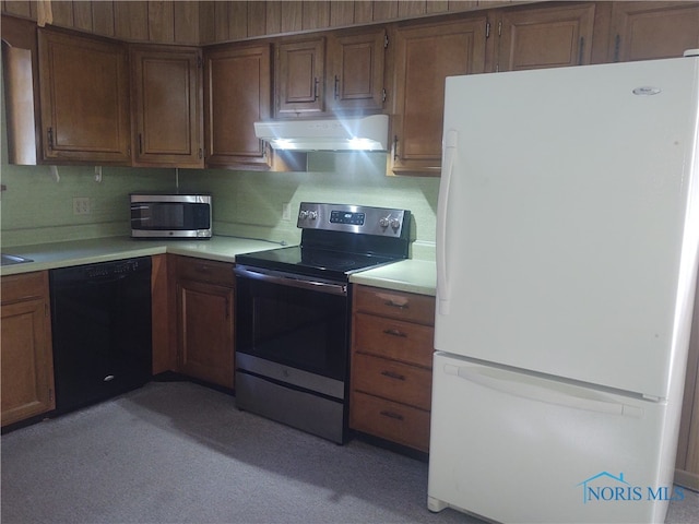 kitchen featuring range hood and appliances with stainless steel finishes