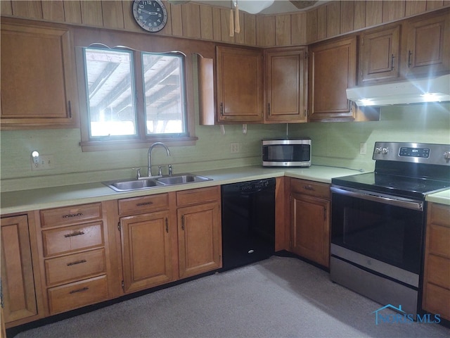 kitchen with sink, stainless steel appliances, and tasteful backsplash