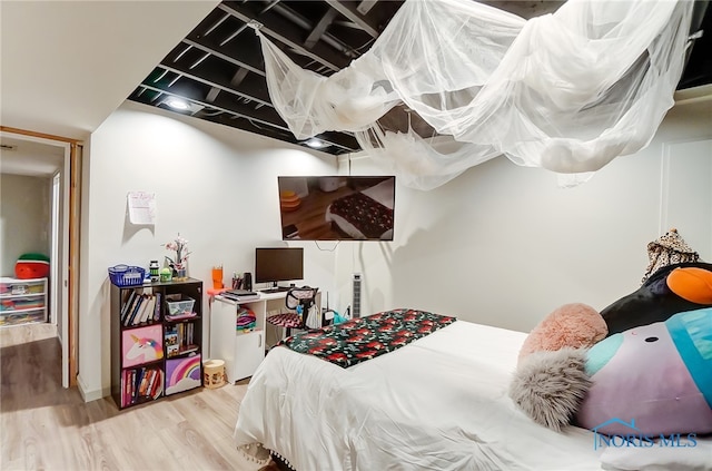 bedroom featuring wood-type flooring