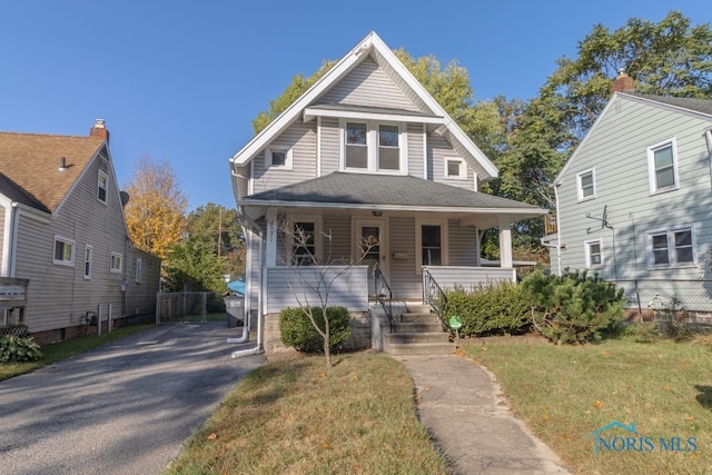 view of front of property with a front lawn and a porch