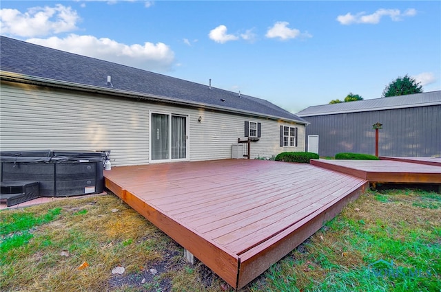 deck featuring a hot tub