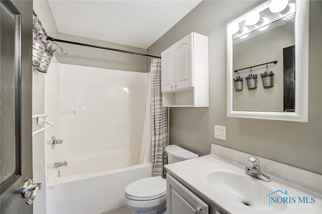 full bathroom with vanity, toilet, and shower / bath combo with shower curtain