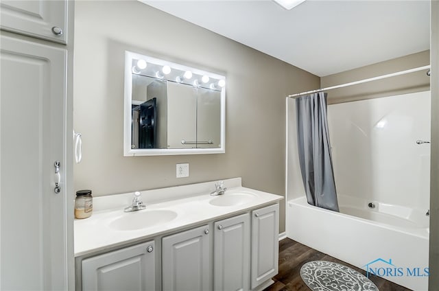 bathroom featuring vanity, shower / tub combo, and hardwood / wood-style flooring