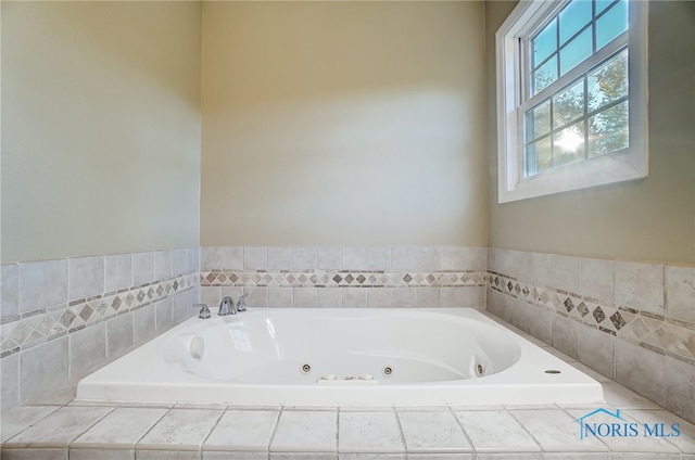 bathroom featuring a relaxing tiled tub