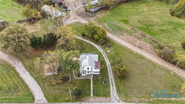 birds eye view of property with a rural view