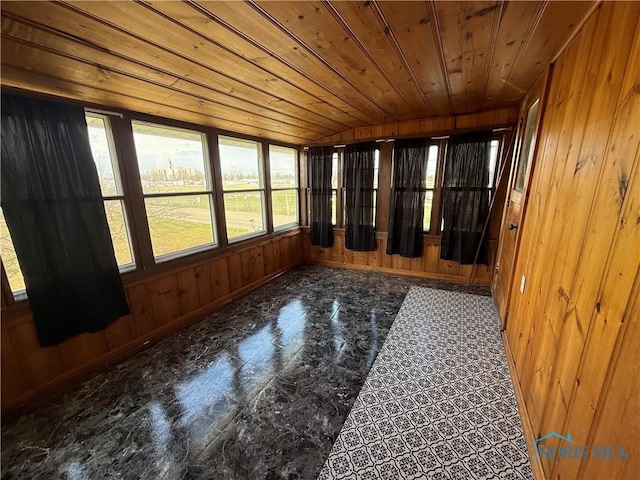 unfurnished sunroom featuring plenty of natural light, lofted ceiling, and wood ceiling