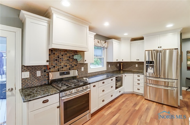 kitchen featuring stainless steel appliances and white cabinets