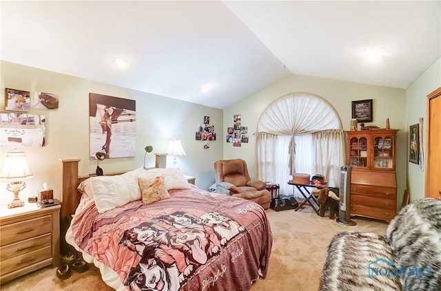 bedroom with light carpet and vaulted ceiling