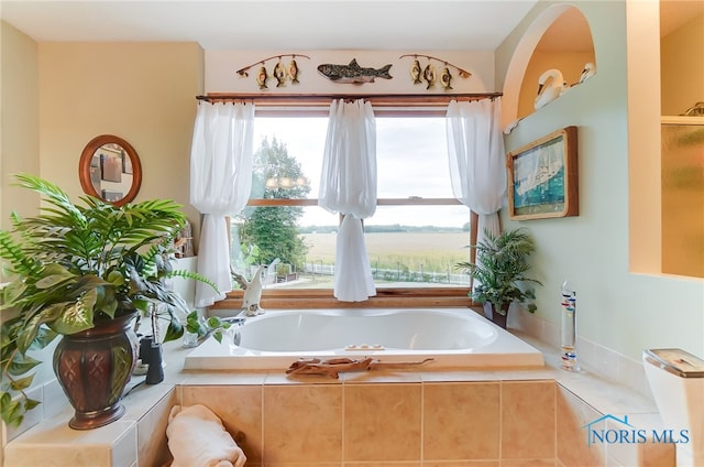 bathroom featuring tiled bath