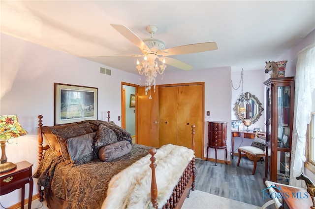 bedroom with a closet, ceiling fan, and multiple windows