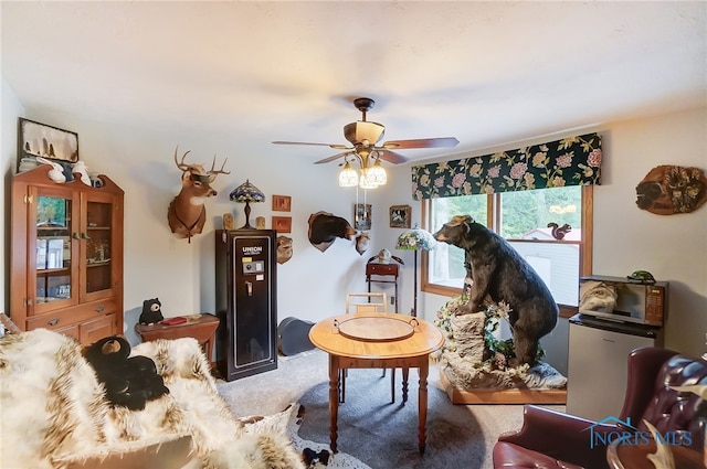 living room featuring carpet and ceiling fan