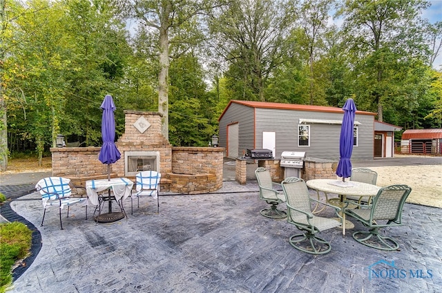 view of patio with exterior kitchen and grilling area