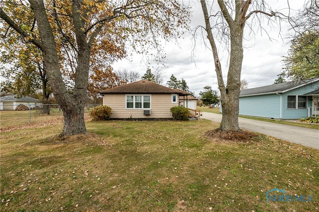 view of property exterior with a yard