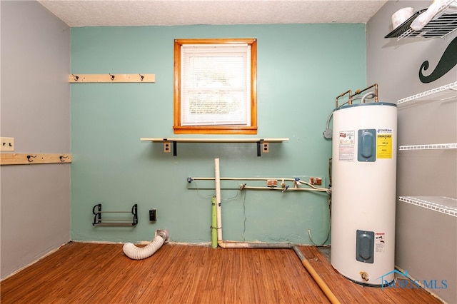 utility room featuring water heater