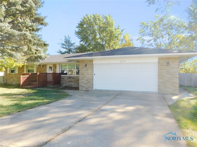 ranch-style house with a front lawn and a garage