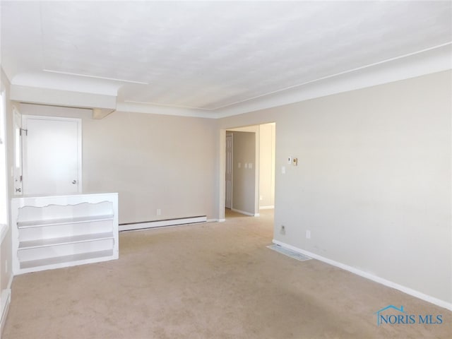 unfurnished room featuring a baseboard radiator and light colored carpet