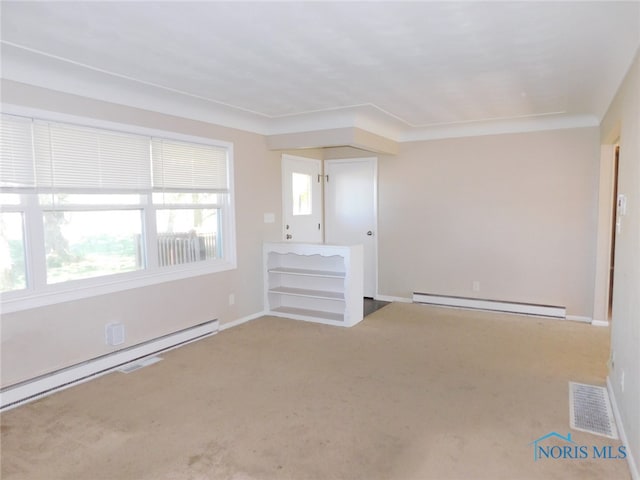 unfurnished room featuring carpet floors and baseboard heating