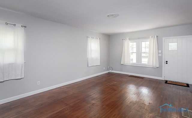 foyer with dark hardwood / wood-style floors