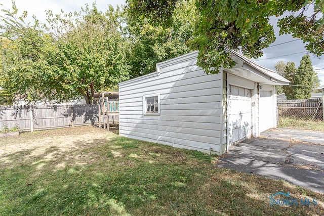 garage featuring a yard