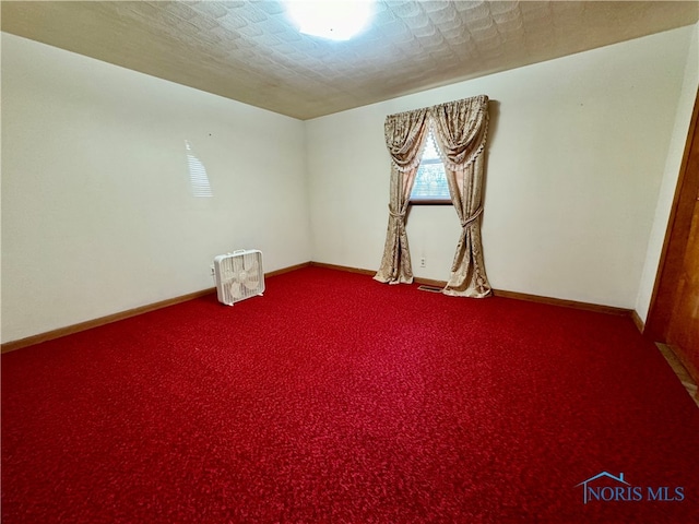 spare room featuring a textured ceiling