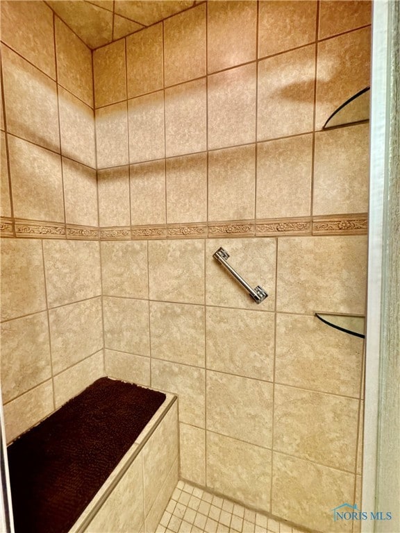 bathroom with tiled shower